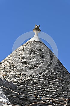 View of the conical roof of the trulli houses in Alberobello, Apulia - Italy