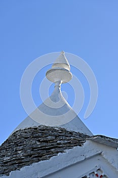 View of the conical roof of the trulli houses in Alberobello, Apulia - Italy