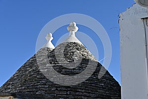 View of the conical roof of the trulli houses in Alberobello, Apulia - Italy