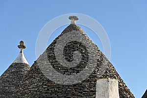 View of the conical roofs of the trulli houses in Alberobello, Apulia - Italy