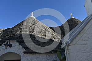 View of the conical roofs of the trulli houses in Alberobello, Apulia - Italy