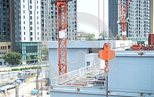 View of the construction site and red cranes for building modern residential area