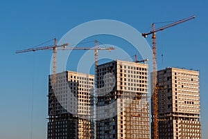 A view on a construction site of three new appartement blocks