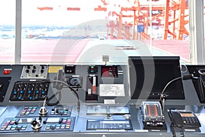 View of the control console on the navigational bridge of the cargo ship.