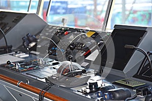 View of the control console on the navigational bridge of the cargo ship.