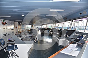 View of the control console on the navigational bridge of the cargo ship.