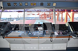 View of the control console on the navigational bridge of the cargo ship.