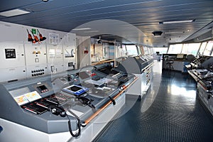 View of the control console on the navigational bridge of the cargo ship.