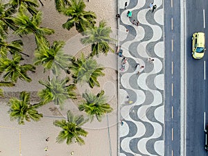 view of Copacabana boardwalk during late afternoon, taken with a drone, with the famous portuguese stone texture . Rio de Janeiro,