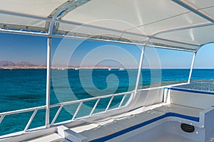View at the coral sea from a white yacht. Perfect place for snorkeling. Summer vacation at sea