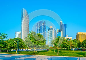 View of a corniche in Abu Dhabi stretching alongside the business center full of high skyscrapers....IMAGE