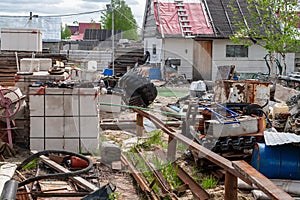 View of the courtyard cluttered with belongings. A mess in the yard