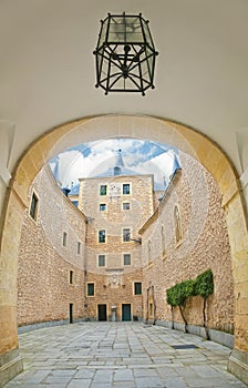 View of courtyard of medieval castle from arc with lantern