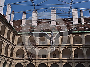 View of the courtyard of Stallburg, part of the Hofburg in Vienna, Austria and used by the Spanish Riding School, with statue.