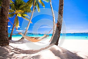 View of cozy straw hammock on the tropical white