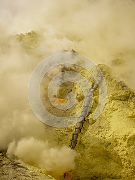 View on the crater of the Ijen volcano in Indonesia, a sulfur mine and toxic gaz