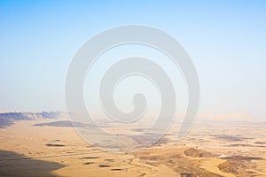 View of the crater from the rock. National park HaMakhtesh Mitzpe Ramon. Unique relief geological erosion land form. Negev,Israel