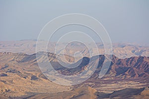 View of the crater from the rock. National park HaMakhtesh Mitzpe Ramon. Unique relief geological erosion land form. Negev,Israel