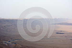 view of the crater from the rock. National park HaMakhtesh Mitzpe Ramon. Unique relief geological erosion land form. Negev,Israel