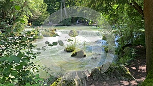 View of a creek in the English garden in Munich, Bayern, Germany. Video with real sound