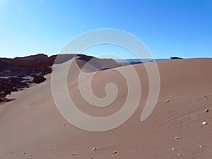 View of the crest of a sand dune in the Atacama Desert at sunset, Chile