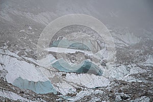 View of crevices in a Khumbu glacier during fog