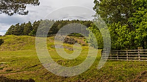 A view from Cropston reservoir towards a Charmian Rock outcrop in Bradgate Park in Leicestershire photo