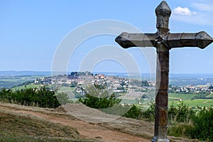 View on cross and Sancerre, medieval hilltop town in Cher department, France overlooking Loire valley with Sancerre Chavignol
