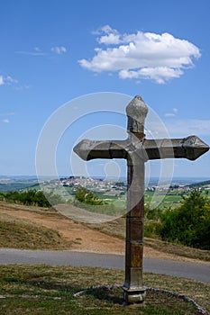 View on cross and Sancerre, medieval hilltop town in Cher department, France overlooking Loire valley with Sancerre Chavignol