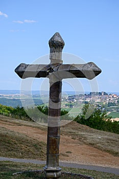 View on cross and Sancerre, medieval hilltop town in Cher department, France overlooking Loire valley with Sancerre Chavignol