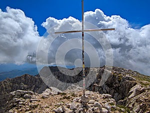 View of the cross in the summit of Monte Sirente in Abruzzo Italy photo