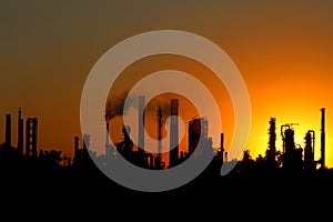 View of crude oil refinery factory during sunset