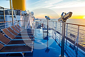 View of cruise ship deck, ocean and sunrise