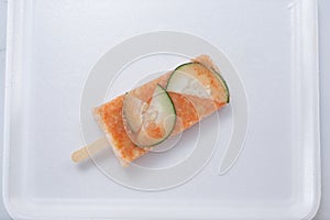 top down cucumber and chile paleta photo
