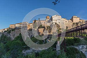 View at the Cuenca Hanging Houses, Casas Colgadas, typical architecture building on slope, metallic bridge, iconic architecture on