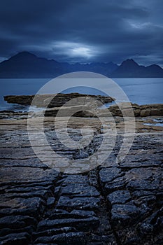 View on Cuillin Hills during late sunset/night from a small village Elgol, located in Isle of Skye, Scotland