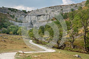 View of the curved cliff at Malham Cove in the Yorkshire Dales N