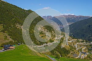 View of a curvy road in the mountain and a beautiful landscape during a sunny spring day in Andorra