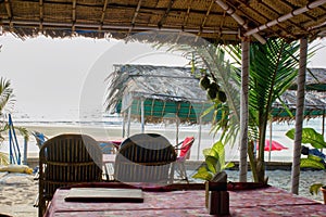 A view from a customer in a restaurant located on a beach in Goa, India | Empty interior of a restaurant against arabian sea