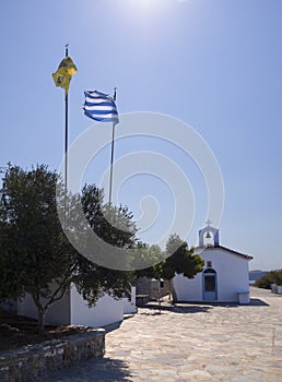 View of the Cycladic style Greek Church on the beach on the Greek island of Evia in Greece on a Sunny day