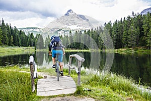 View of cyclist riding mountain bike on trail in Dolomites,Tre C