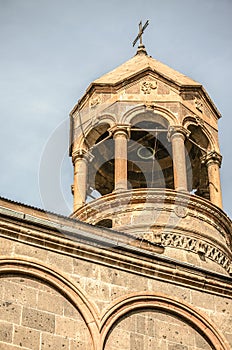 View of cylindrical bell tower with a forged cross in of the Church of St.Mesrop Mashtots