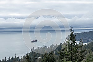 View of The Cypress Pop-up Village lookout with a large ship in the background