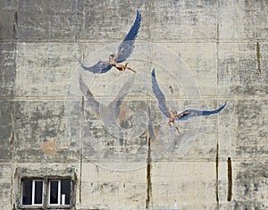 View of Daedalus and Icarus artwork on a stained wall