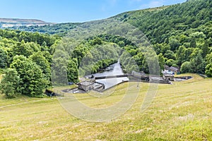 A view from the dam wall towards outlet from Ladybower reservoir, Derbyshire, UK