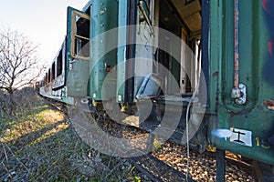 Damaged train wagons in an old abandoned railway network