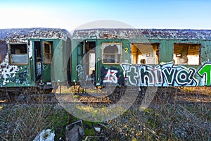 Damaged train wagons in an old abandoned railway network