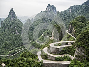 A view of the dangerous 99 curves at the Tongtian Road to Tianmen Mountain, The Heaven`s Gate at Zhangjiagie, Hunan Province, Ch