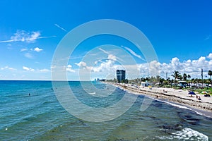 View of Dania beach in Hollywood, Florida. People enjoying their vacation and swimming in the beach in summer