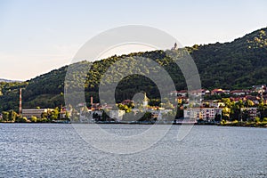 View of Danube river and Orsova city vegetation and buildings, waterfront view. Orsova, Romania, 2021